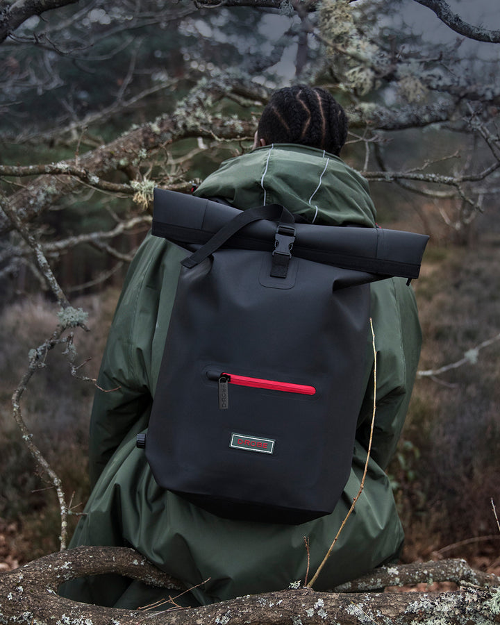 Models in the woodland wearing our functional and stylish outdoor robes and our multi-functional roll-top rucksacks, which have extra storage and waterproof outer for all-weather protection. Perfect as an after swim coat, surf robe, beach coat and dog walking jacket. 